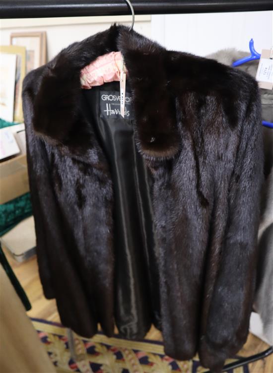 A dark brown mink jacket with a Grosvenor Harrods label